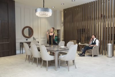 Wide-angle photo of young Charming couple in the living room. High quality photo
